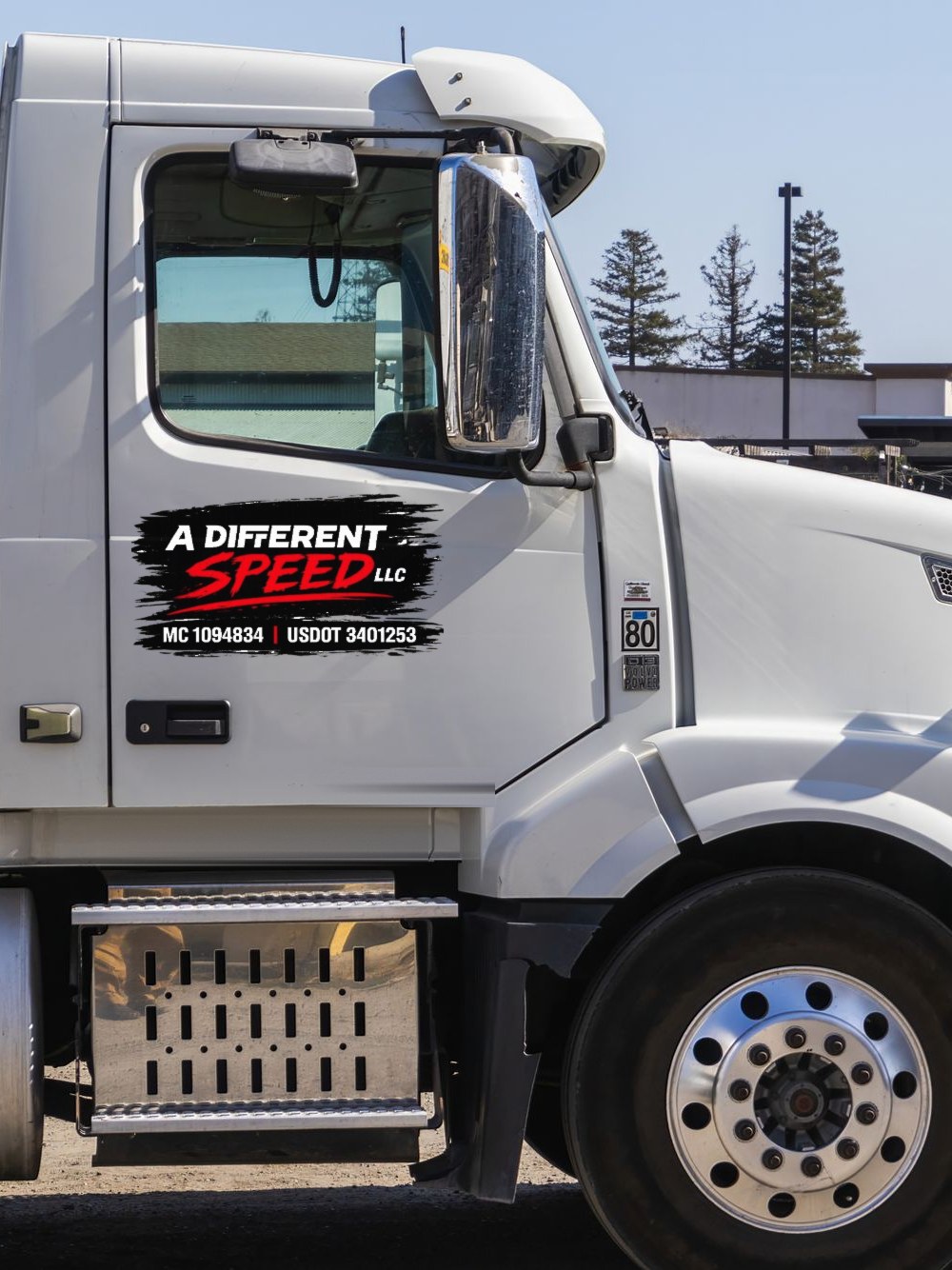 Volvo VNL day cab with the A Different Speed door decal